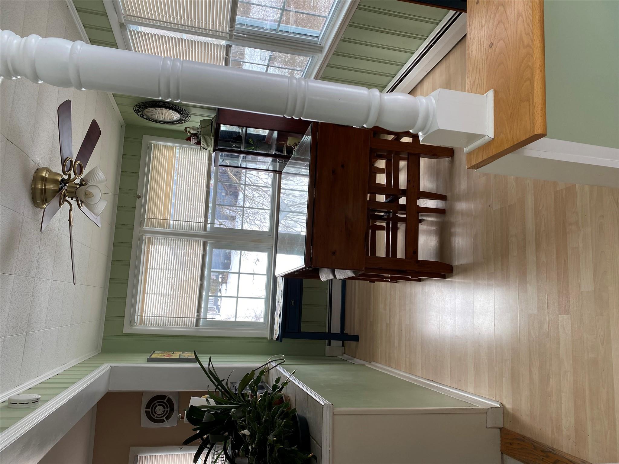 168 Prospect Road Monroe, NY 10950 - Photo 9 of 15 Dining space featuring light wood-style flooring, crown molding, a baseboard heating unit, and a ceiling fan