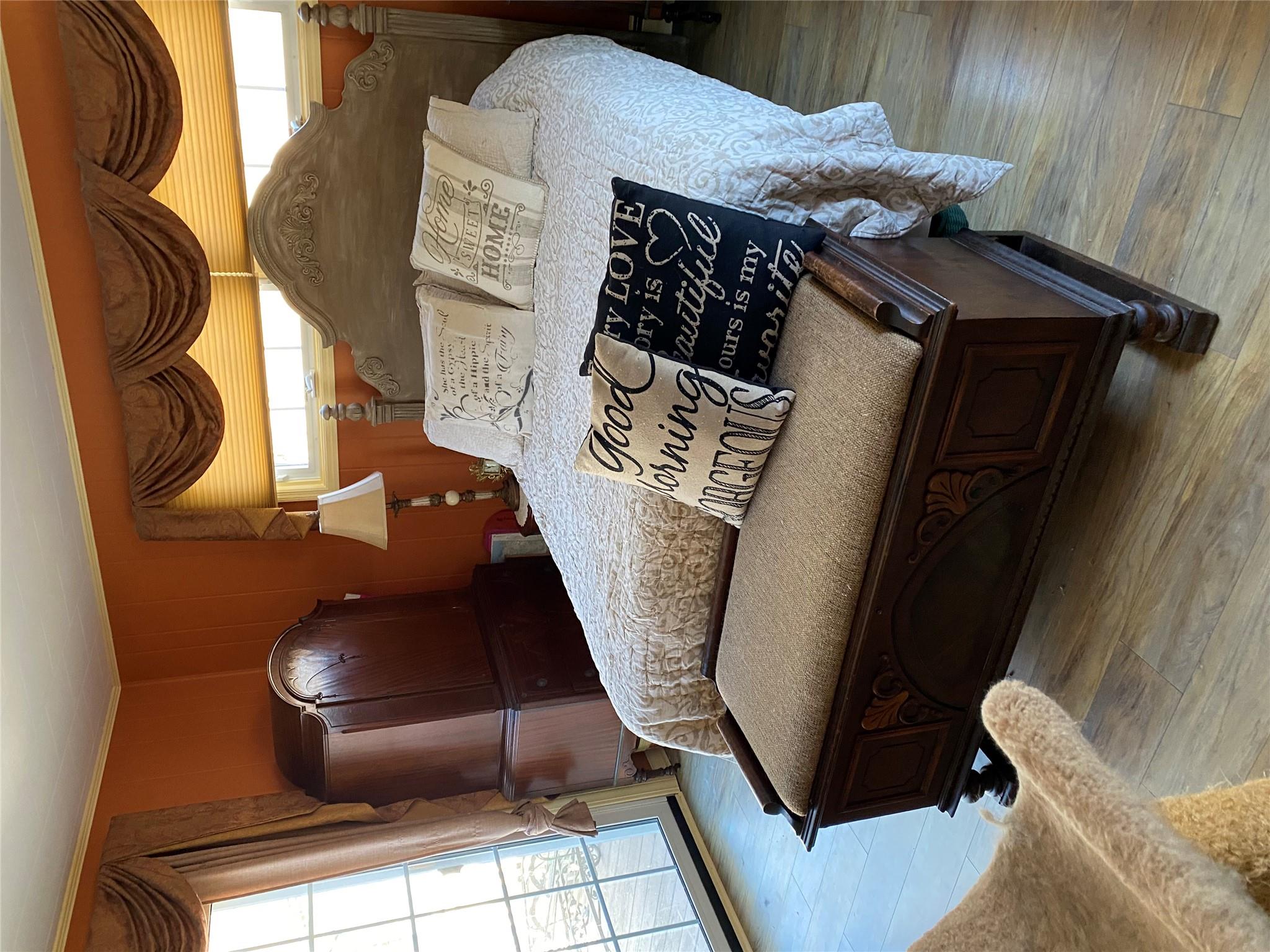 168 Prospect Road Monroe, NY 10950 - Photo 10 of 15 Bedroom with light wood finished floors, wood walls, crown molding, and access to outside