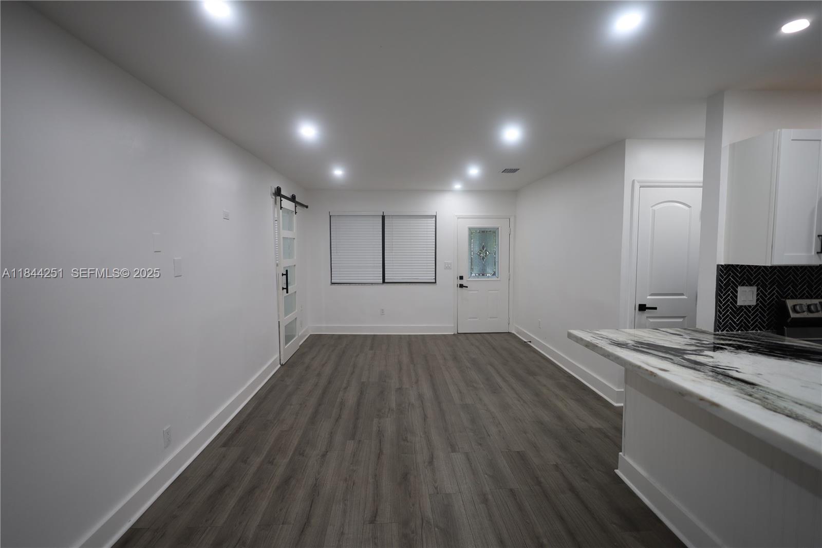 3955 Southwest 69th Avenue Miami, FL 33155 - Photo 11 of 35 a view of empty room with wooden floor