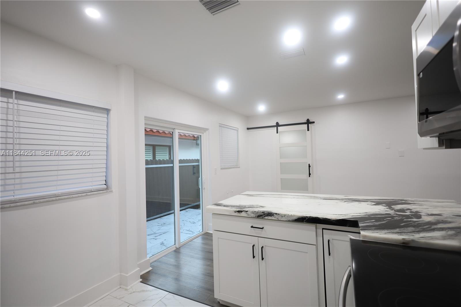 3955 Southwest 69th Avenue Miami, FL 33155 - Photo 12 of 35 a kitchen with a sink and cabinets