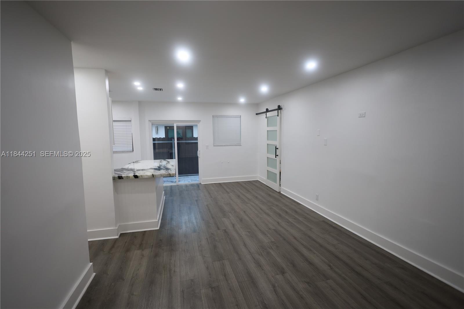 3955 Southwest 69th Avenue Miami, FL 33155 - Photo 17 of 35 a view of empty room with wooden floor
