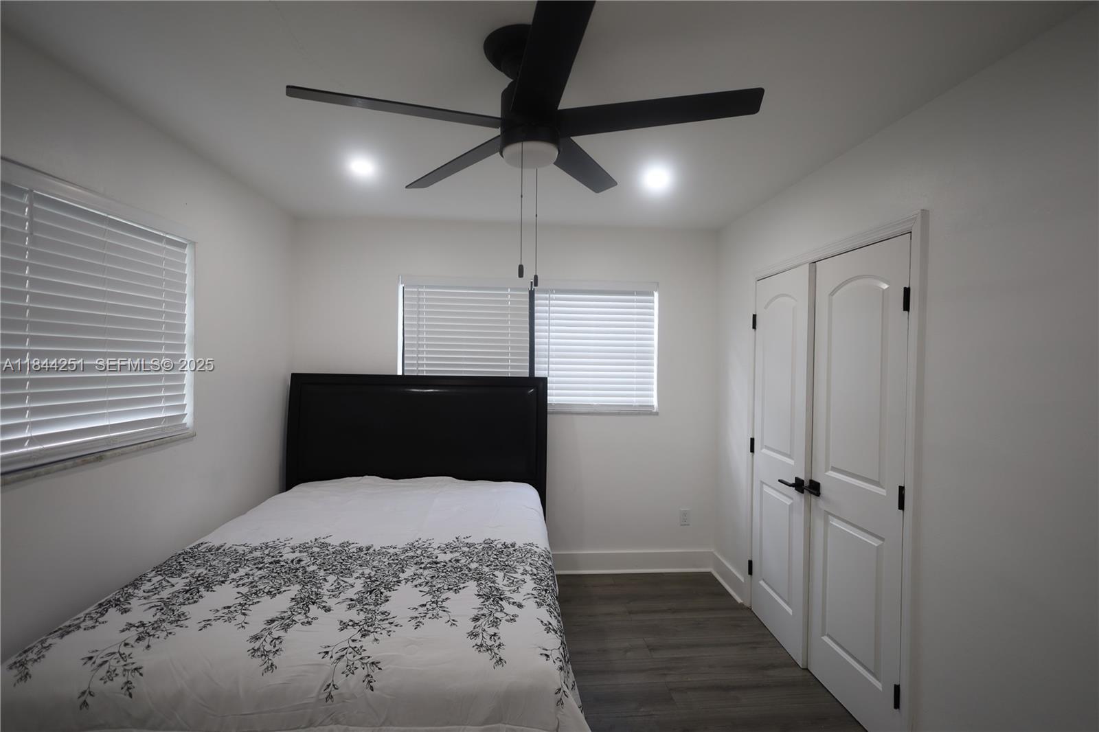 3955 Southwest 69th Avenue Miami, FL 33155 - Photo 20 of 35 a bedroom with a bed and a walk in closet