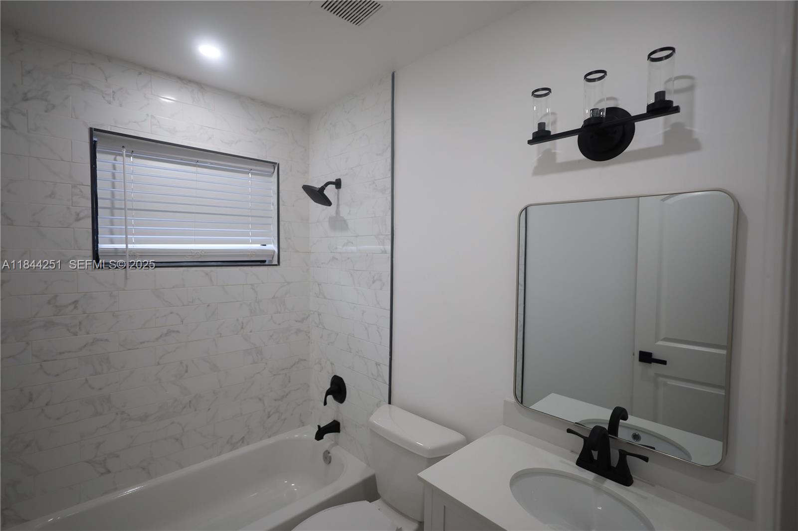 3955 Southwest 69th Avenue Miami, FL 33155 - Photo 21 of 35 a bathroom with a tub sink and mirror