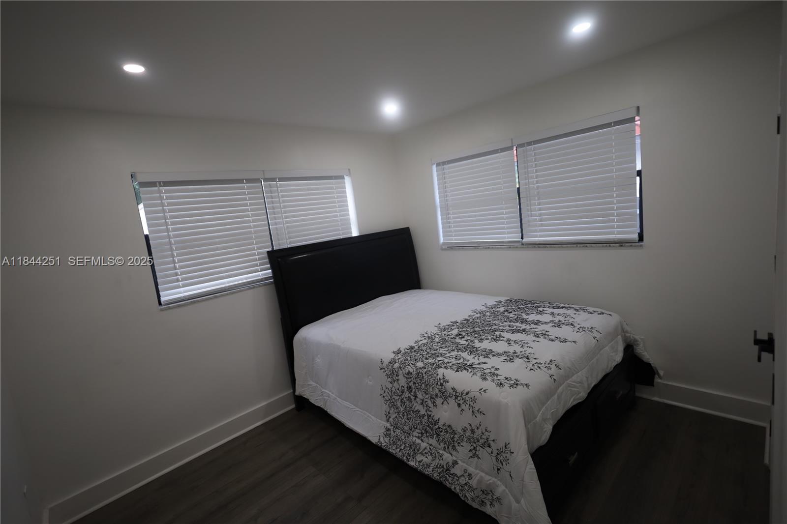 3955 Southwest 69th Avenue Miami, FL 33155 - Photo 23 of 35 a bedroom with a bed and a window