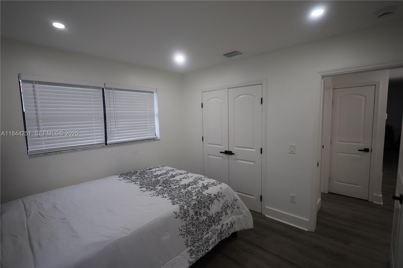 3955 Southwest 69th Avenue Miami, FL 33155 - Photo 24 of 35 a bedroom with a bed and a window