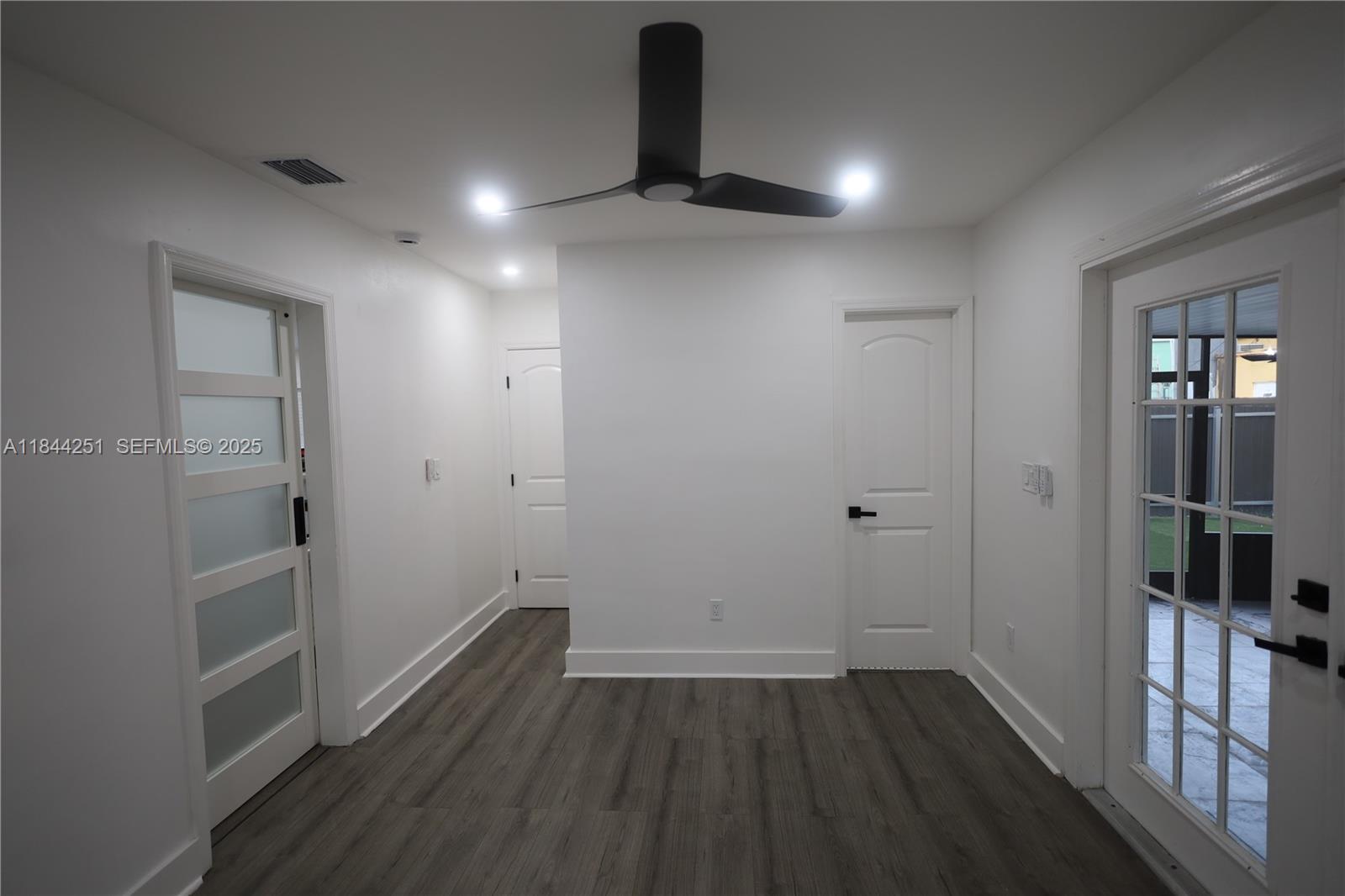 3955 Southwest 69th Avenue Miami, FL 33155 - Photo 29 of 35 wooden floor in an empty room with a window