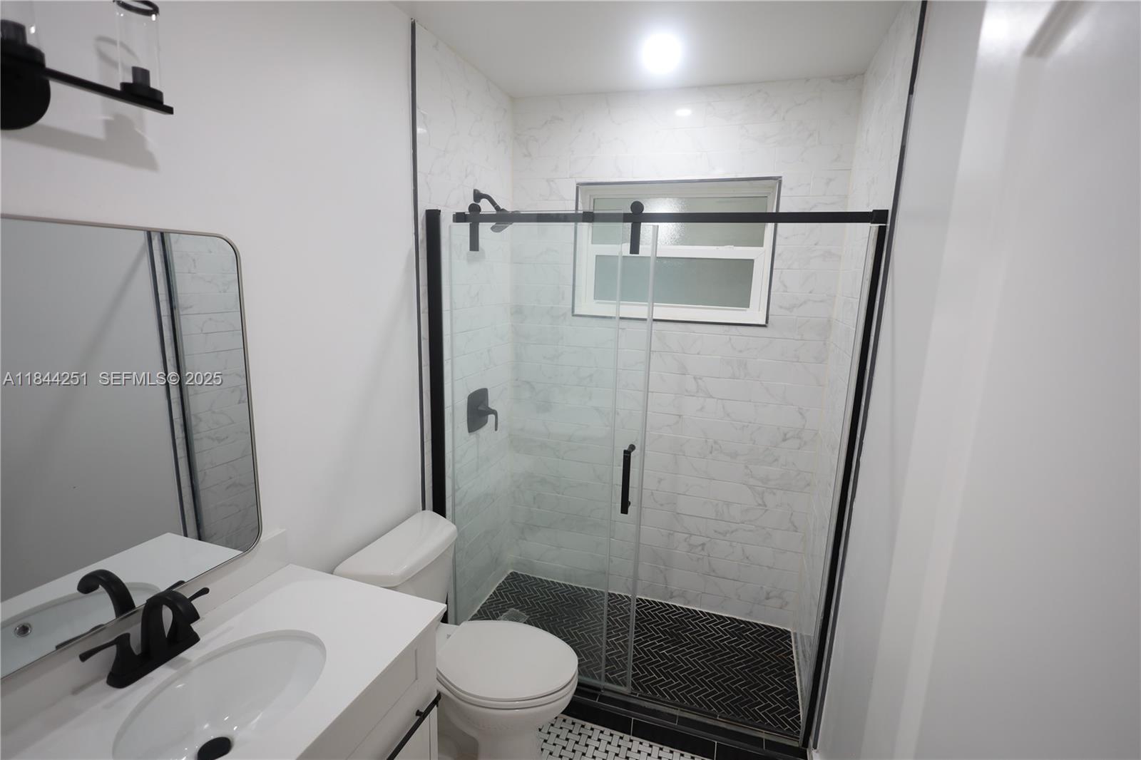 3955 Southwest 69th Avenue Miami, FL 33155 - Photo 32 of 35 a bathroom with a sink toilet and shower