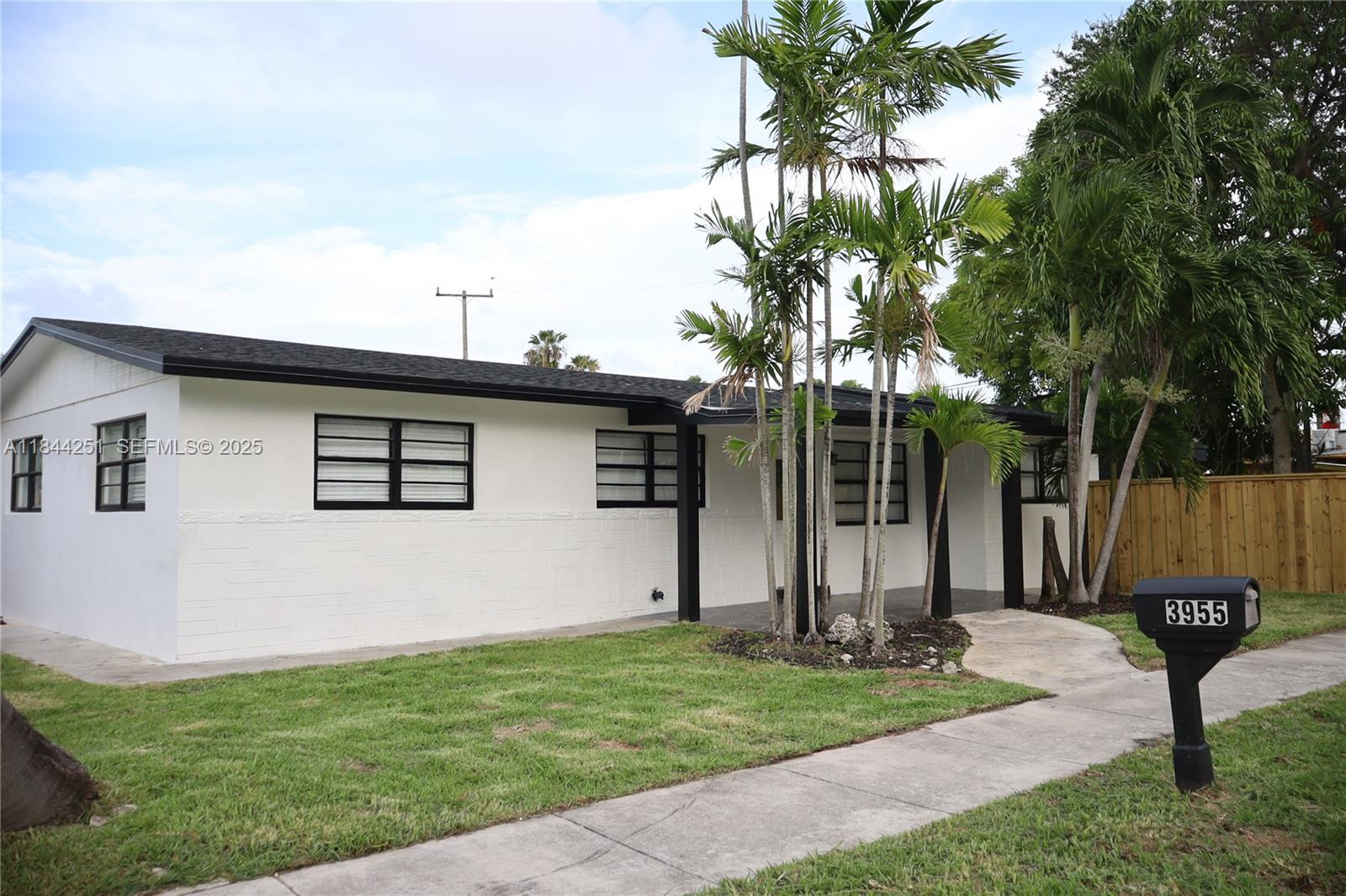 3955 Southwest 69th Avenue Miami, FL 33155 - Photo 9 of 35 a front view of a house with garden