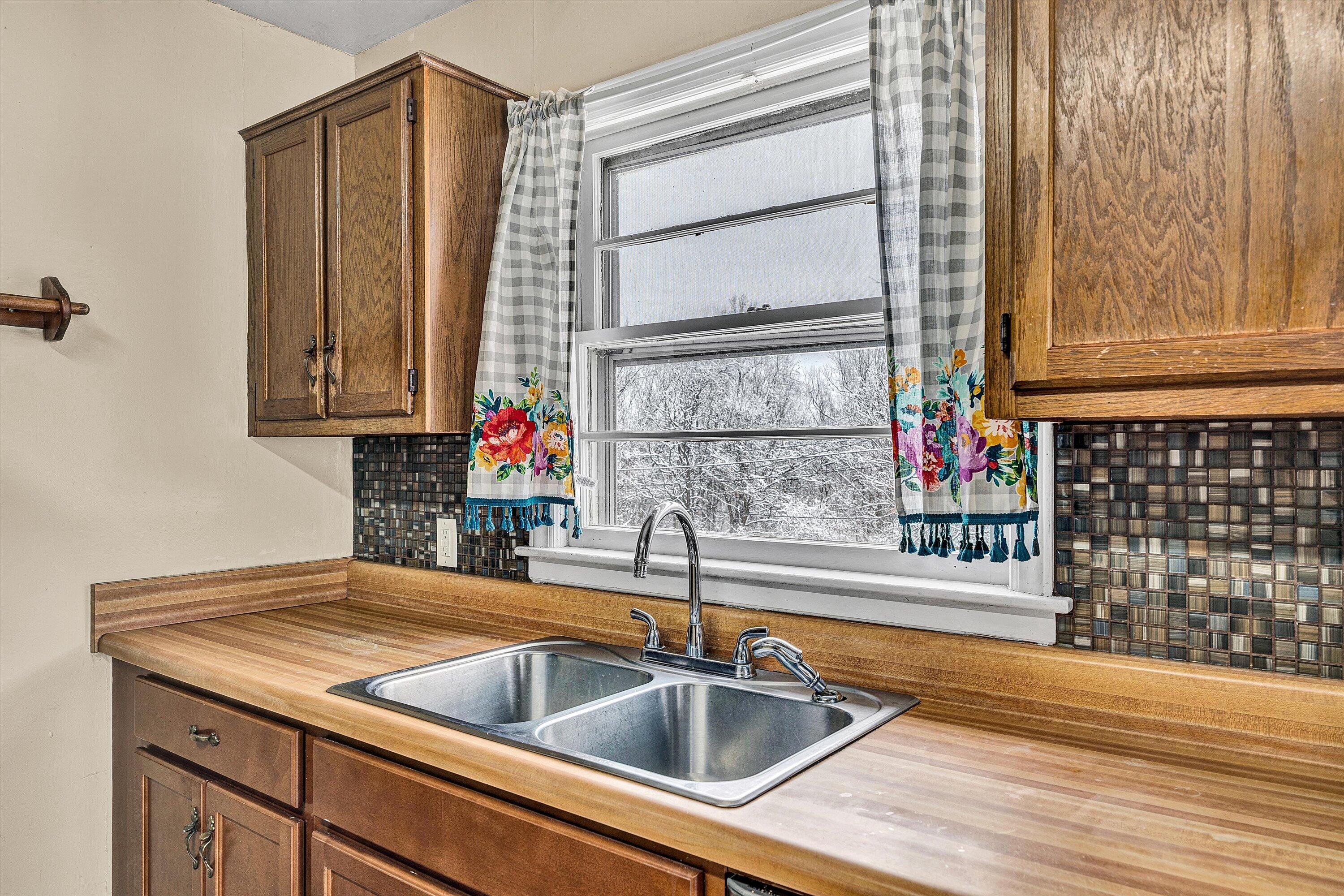 402 Cherryhill Road Northwest Roanoke, VA 24017 - Photo 13 of 42 a kitchen with a sink and a window