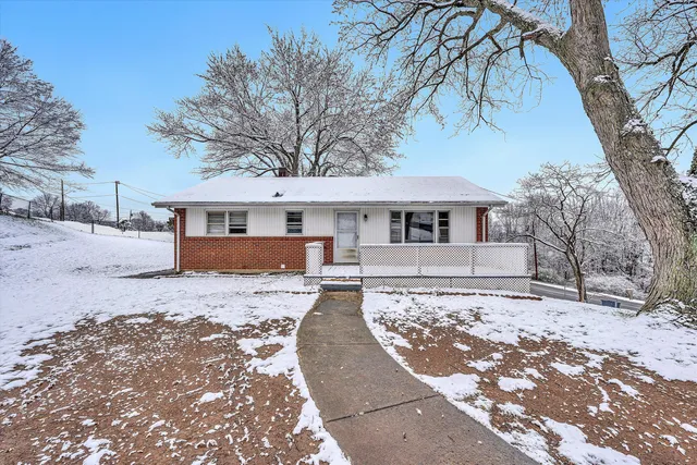 a view of a yard with wooden fence