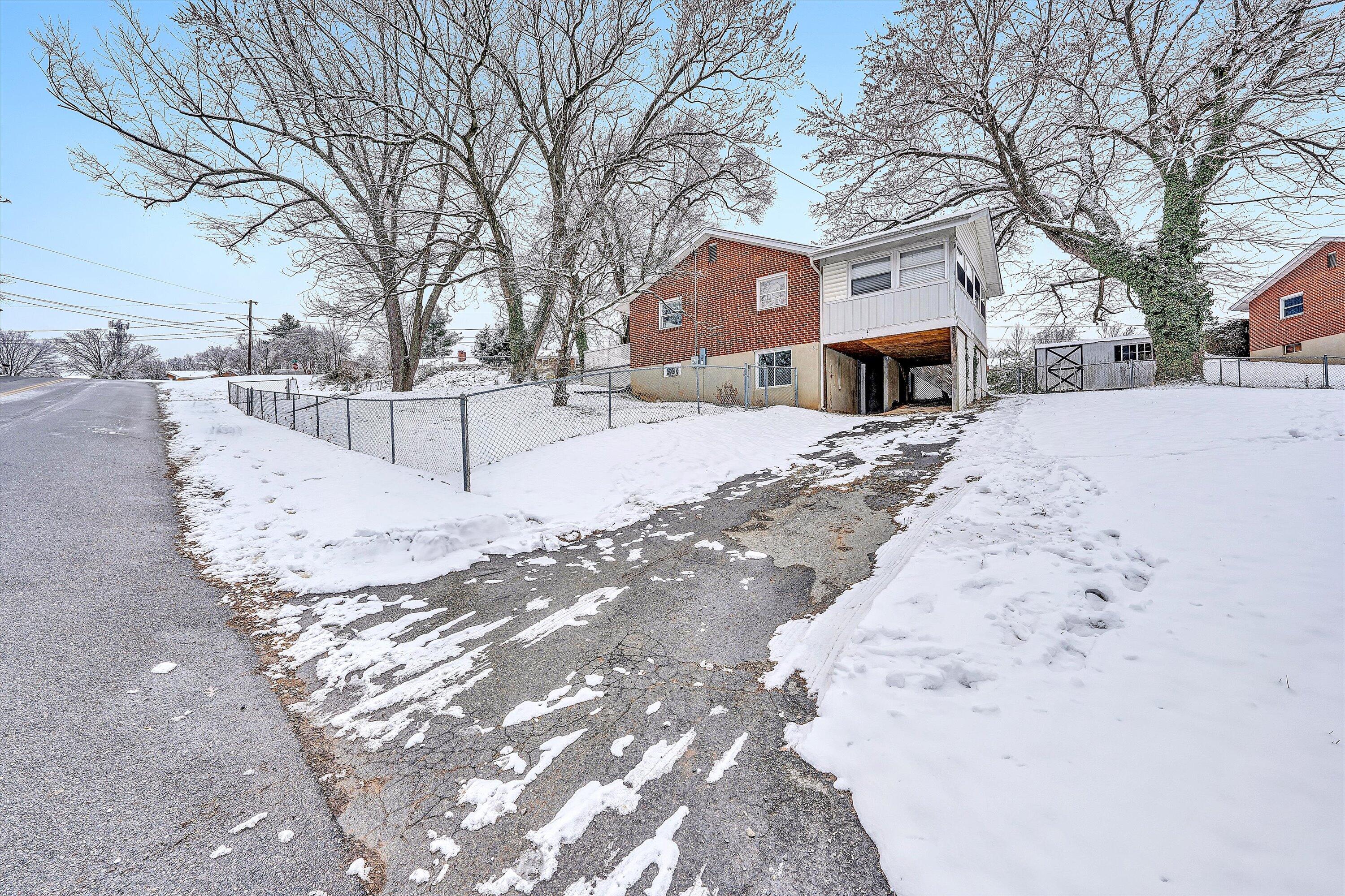 402 Cherryhill Road Northwest Roanoke, VA 24017 - Photo 42 of 42 a building with a snow on the road