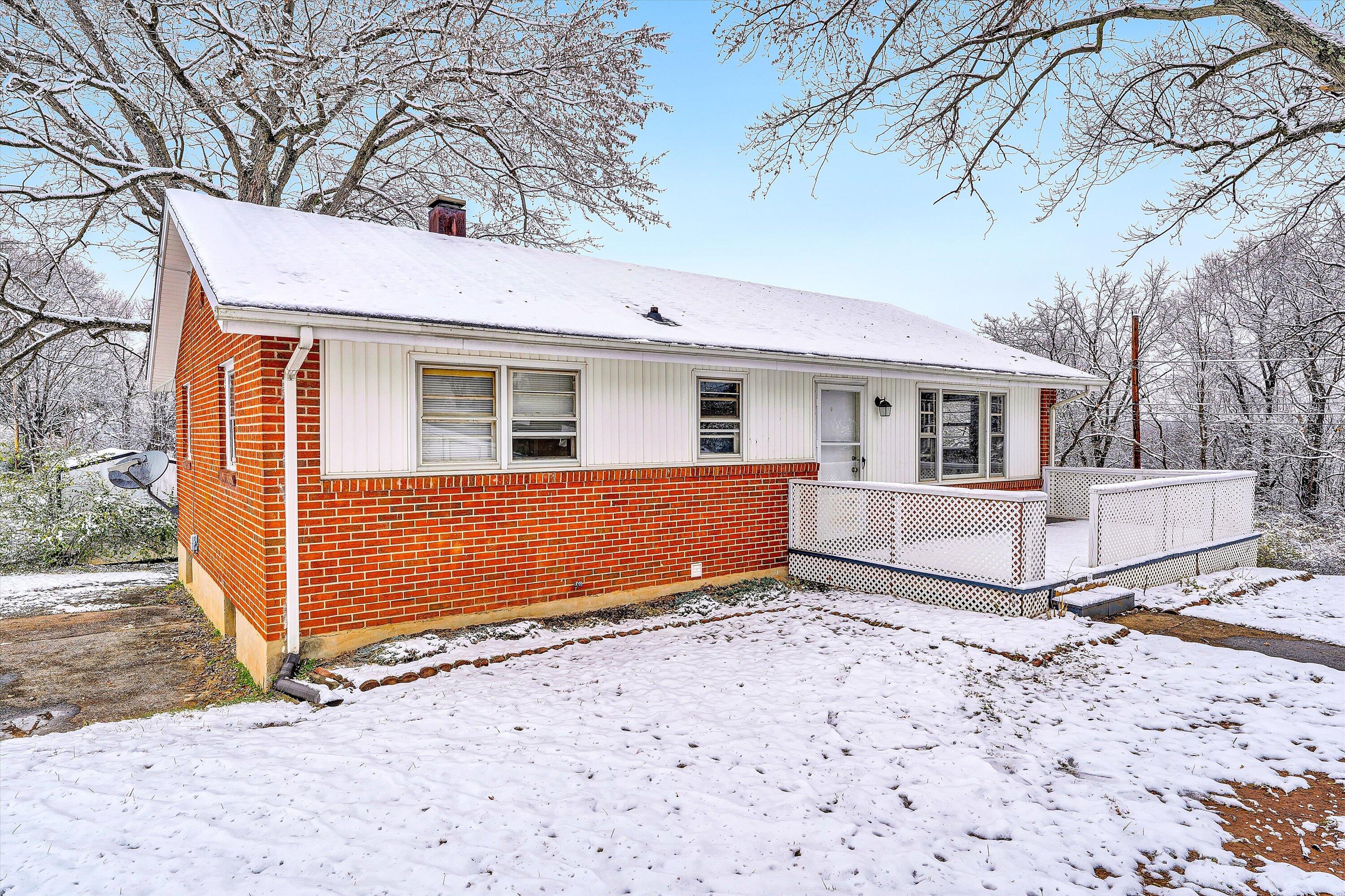 402 Cherryhill Road Northwest Roanoke, VA 24017 - Photo 6 of 42 a view of house with a large tree and wooden fence