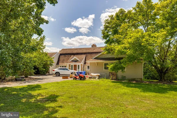 a aerial view of a house with a yard