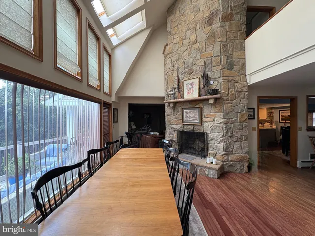 a view of a livingroom with furniture window and wooden floor