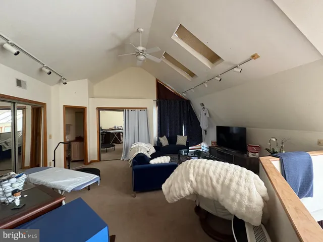 a bedroom with bed and window