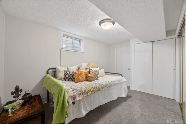 a bedroom with a bed and closet