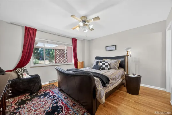 a bedroom with bed and a window