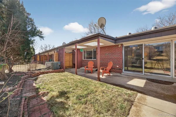 a view of a house with backyard sitting area and porch