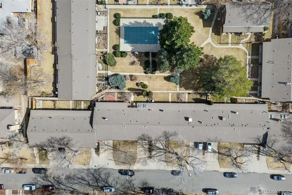 an aerial view of residential houses with outdoor space