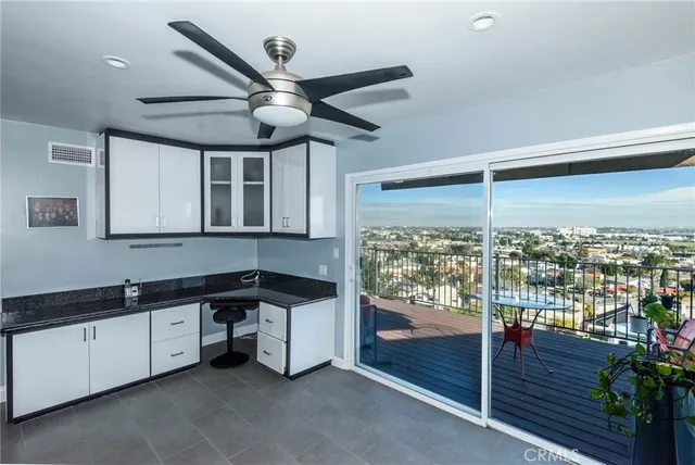 a kitchen with a sink and wooden cabinets