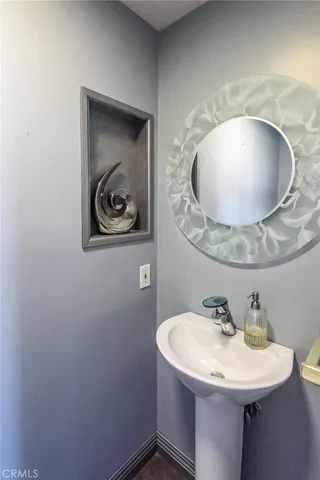 a bathroom with a sink and mirror