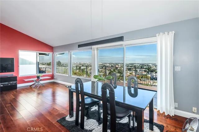 a view of a livingroom with furniture wooden floor and a window