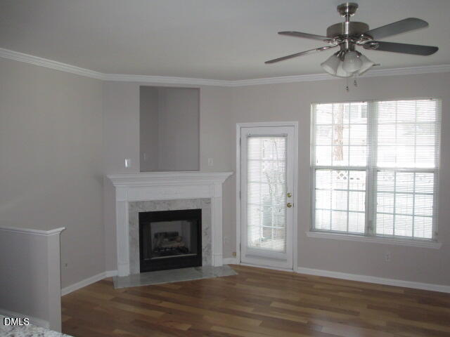 5743 Corbon Crest Lane Raleigh, NC 27612 - Photo 2 of 13 a view of a livingroom with a fireplace and window
