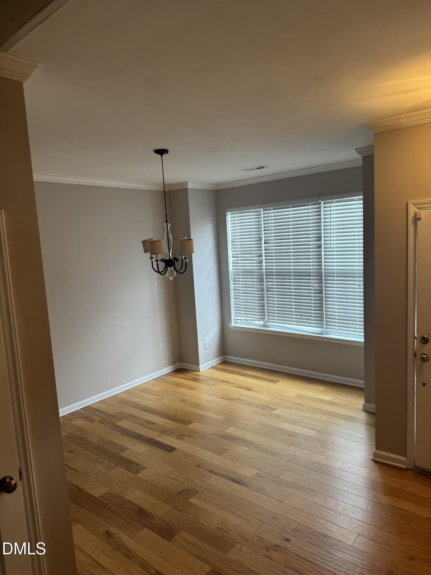5743 Corbon Crest Lane Raleigh, NC 27612 - Photo 6 of 13 a view of an empty room with a window