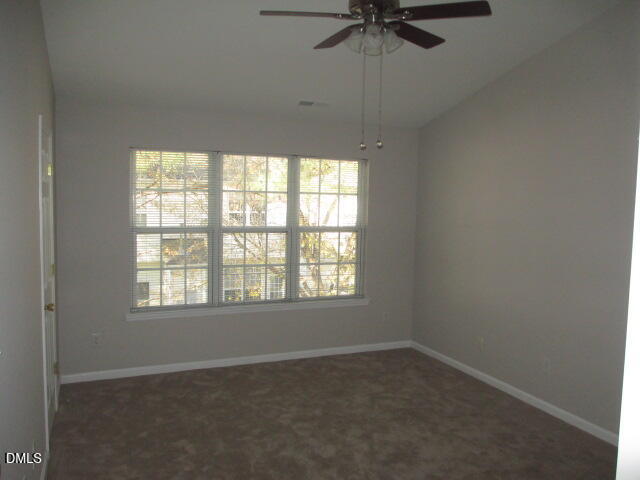 5743 Corbon Crest Lane Raleigh, NC 27612 - Photo 10 of 13 an empty room with a window