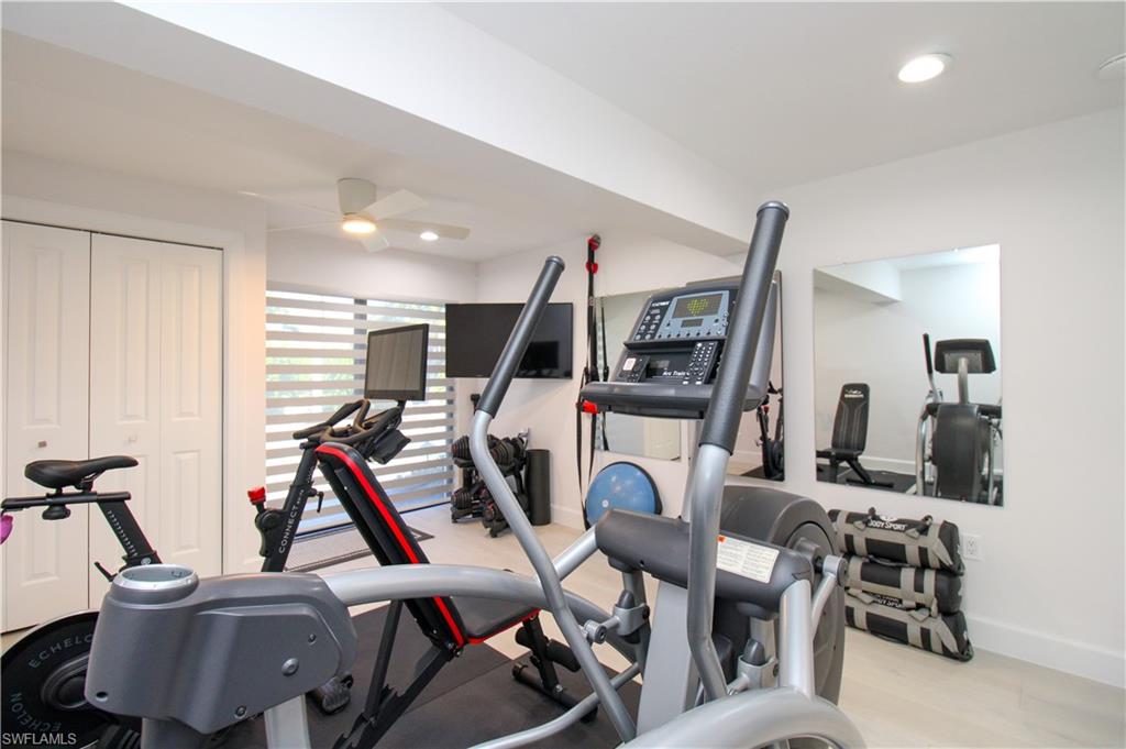 1555 Crayton Road Naples, FL 34102 - Photo 17 of 50 Workout area featuring light hardwood / wood-style floors and ceiling fan