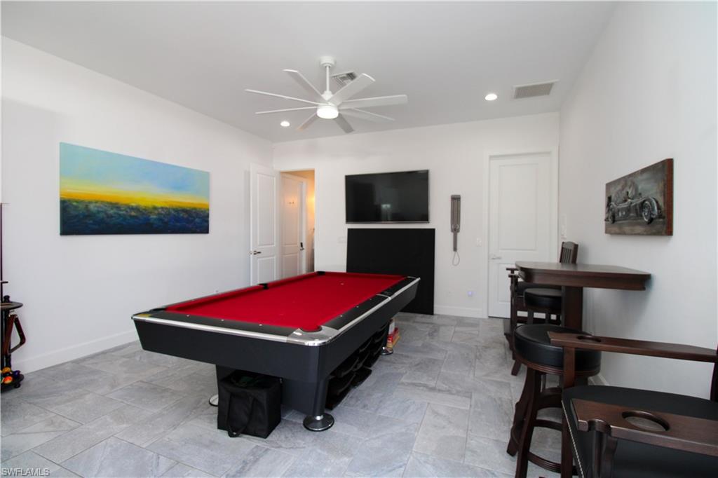 1555 Crayton Road Naples, FL 34102 - Photo 28 of 50 Playroom with ceiling fan and billiards