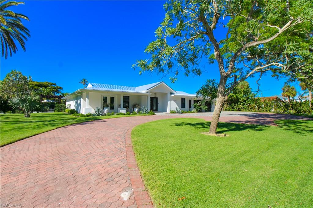 1555 Crayton Road Naples, FL 34102 - Photo 3 of 50 Ranch-style home with a front yard