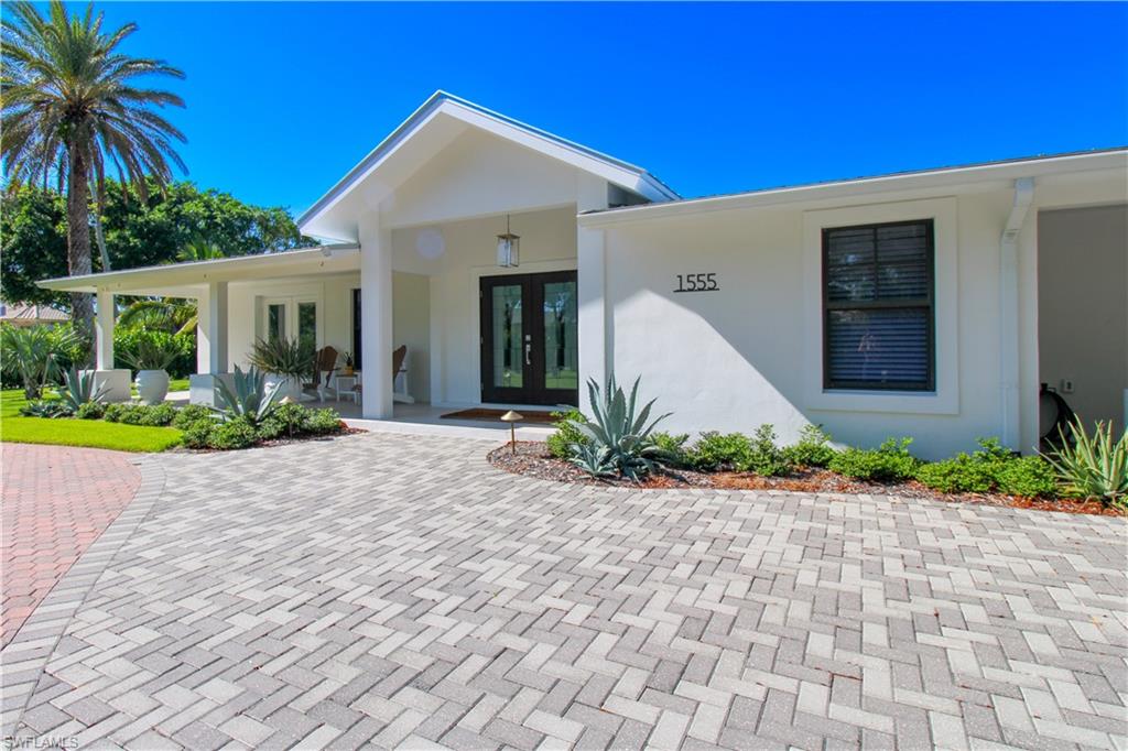 1555 Crayton Road Naples, FL 34102 - Photo 4 of 50 Property entrance with a porch and french doors