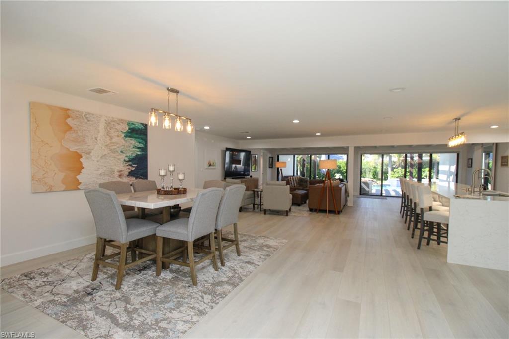 1555 Crayton Road Naples, FL 34102 - Photo 6 of 50 Dining space featuring sink and light wood-type flooring