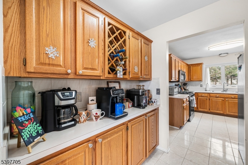 50 Blau Road Hackettstown, NJ 07840 - Photo 12 of 35 a kitchen with stainless steel appliances granite countertop a stove a sink and a microwave