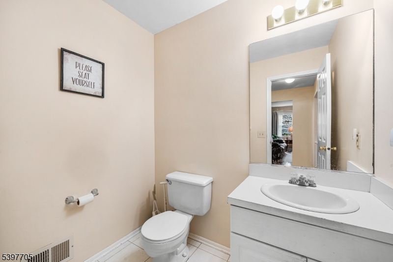 50 Blau Road Hackettstown, NJ 07840 - Photo 18 of 35 a bathroom with a toilet a sink and mirror