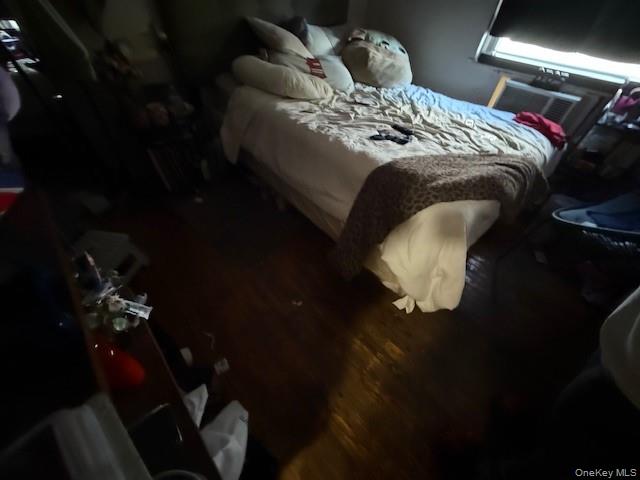 2120 Clinton Avenue Bronx, NY 10457 - Photo 17 of 21 a bed sitting in a bedroom next to a lamp
