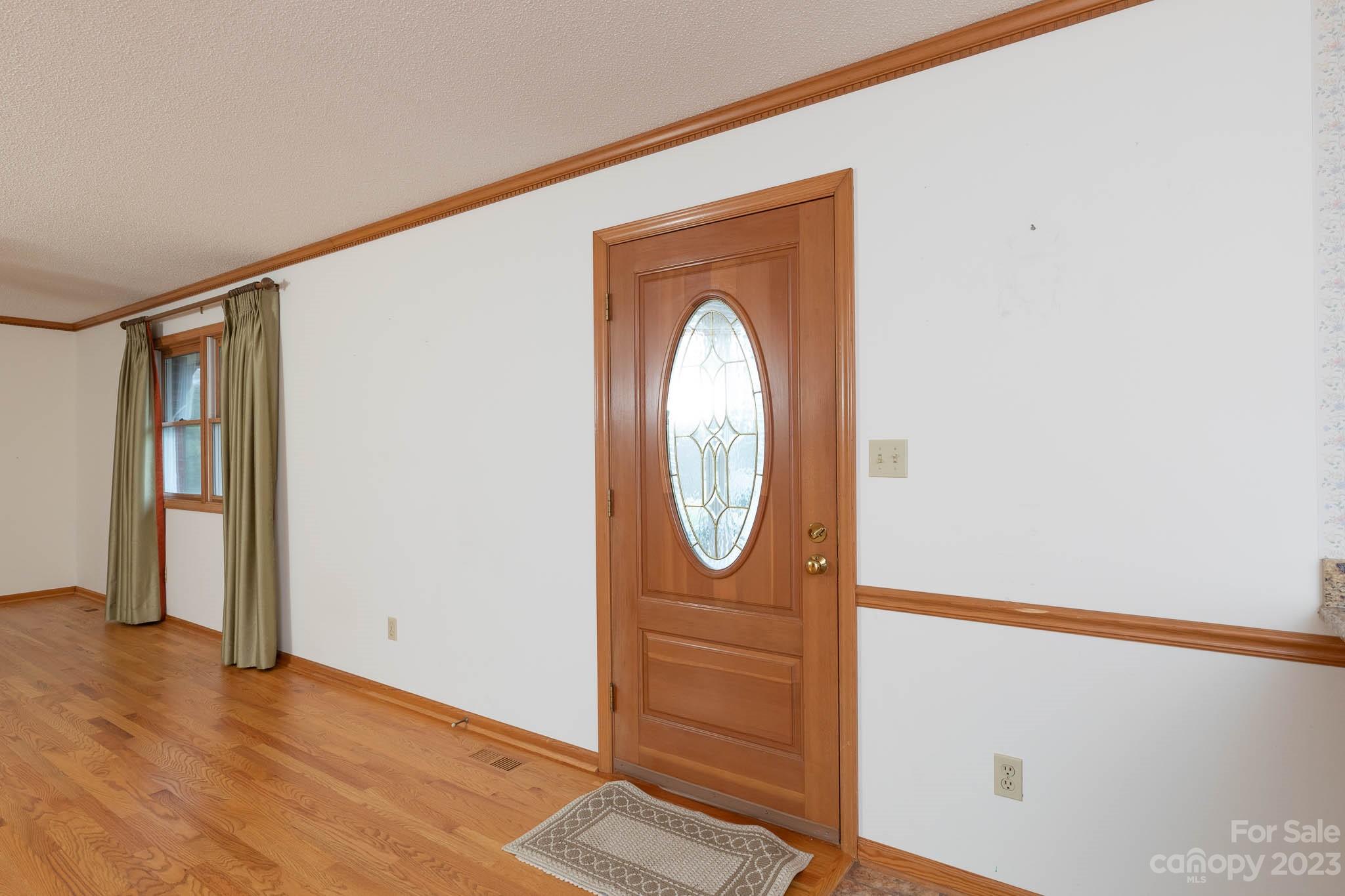 7869 Cherry Point Drive Denver, NC 28037 - Photo 11 of 38 a view of front door with wooden floor