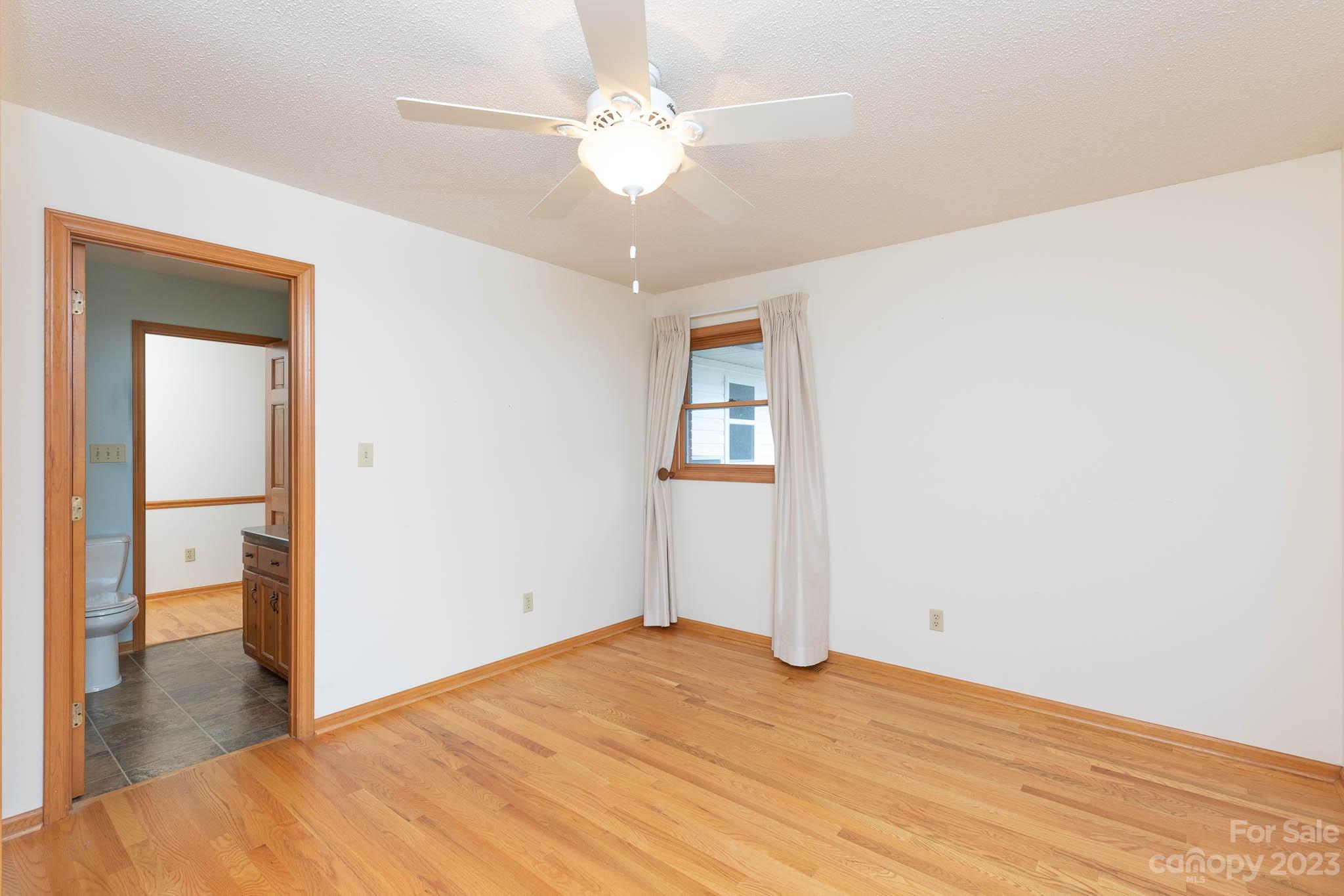 7869 Cherry Point Drive Denver, NC 28037 - Photo 13 of 38 a view of empty room with wooden floor