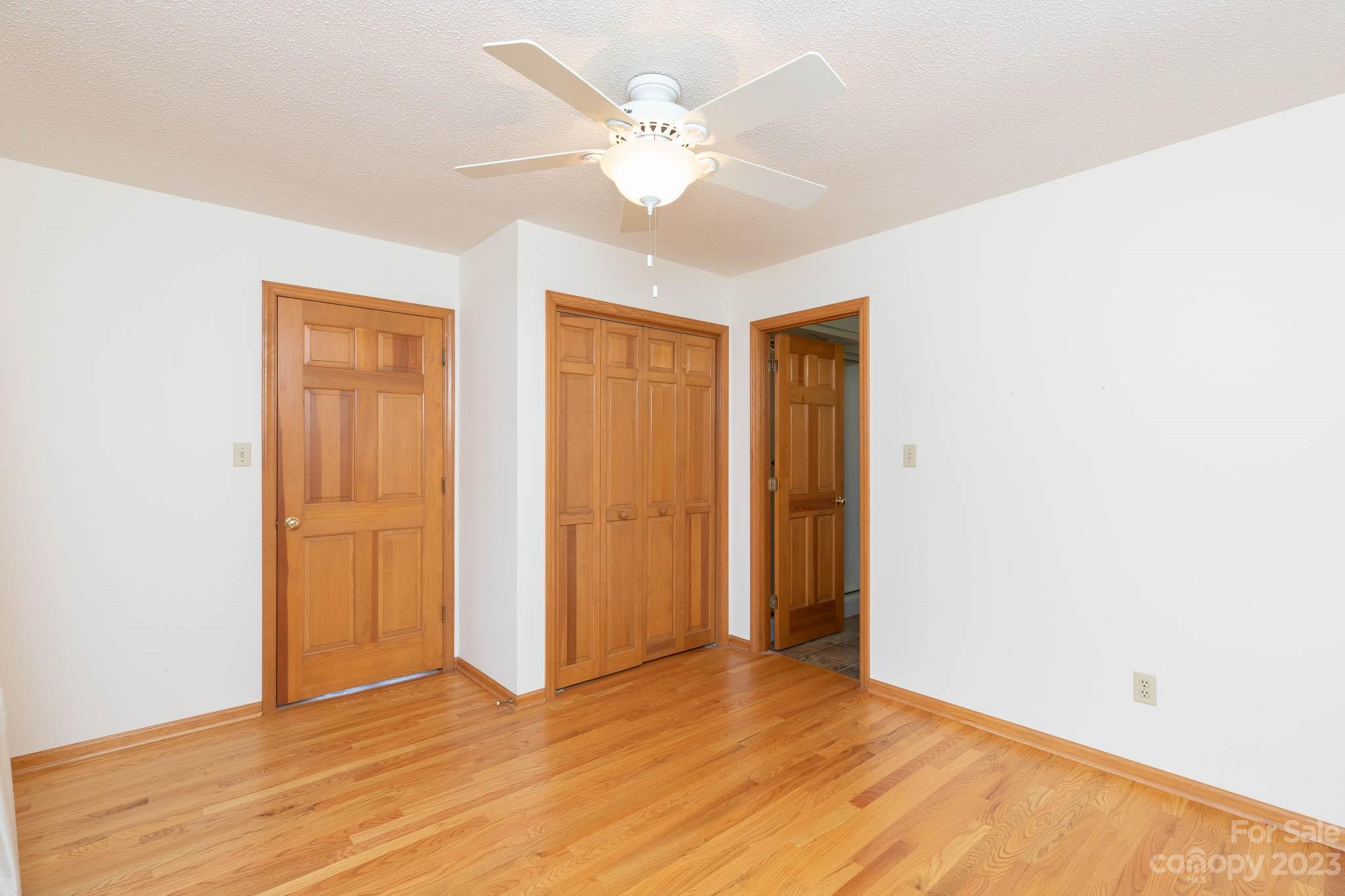 7869 Cherry Point Drive Denver, NC 28037 - Photo 14 of 38 a view of an empty room with wooden floor