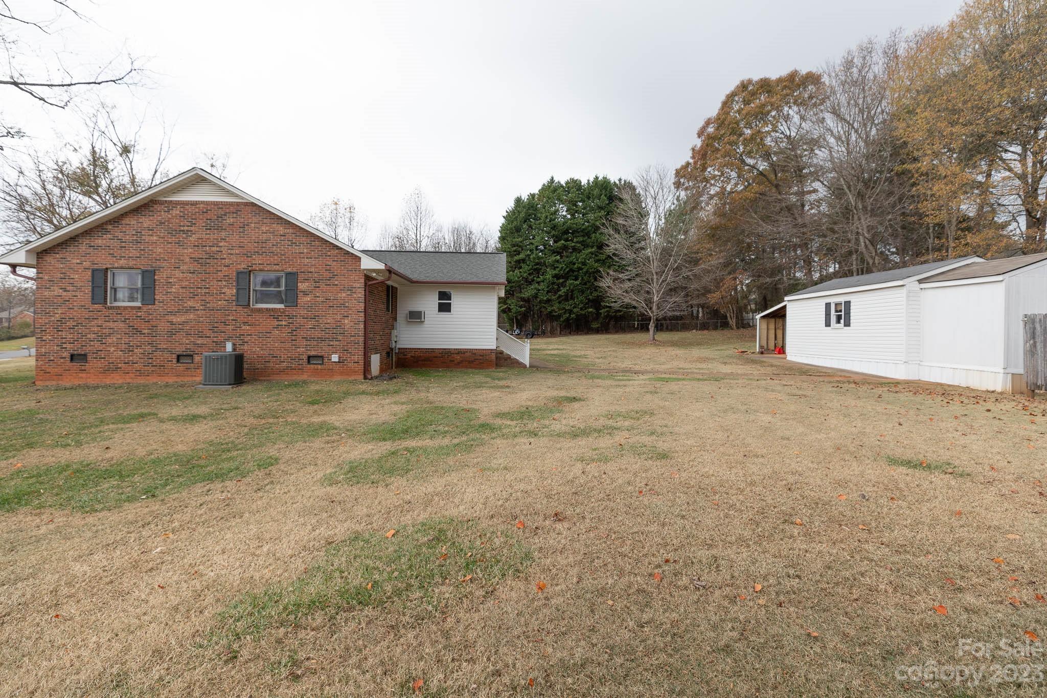 7869 Cherry Point Drive Denver, NC 28037 - Photo 34 of 38 a view of a house with a yard
