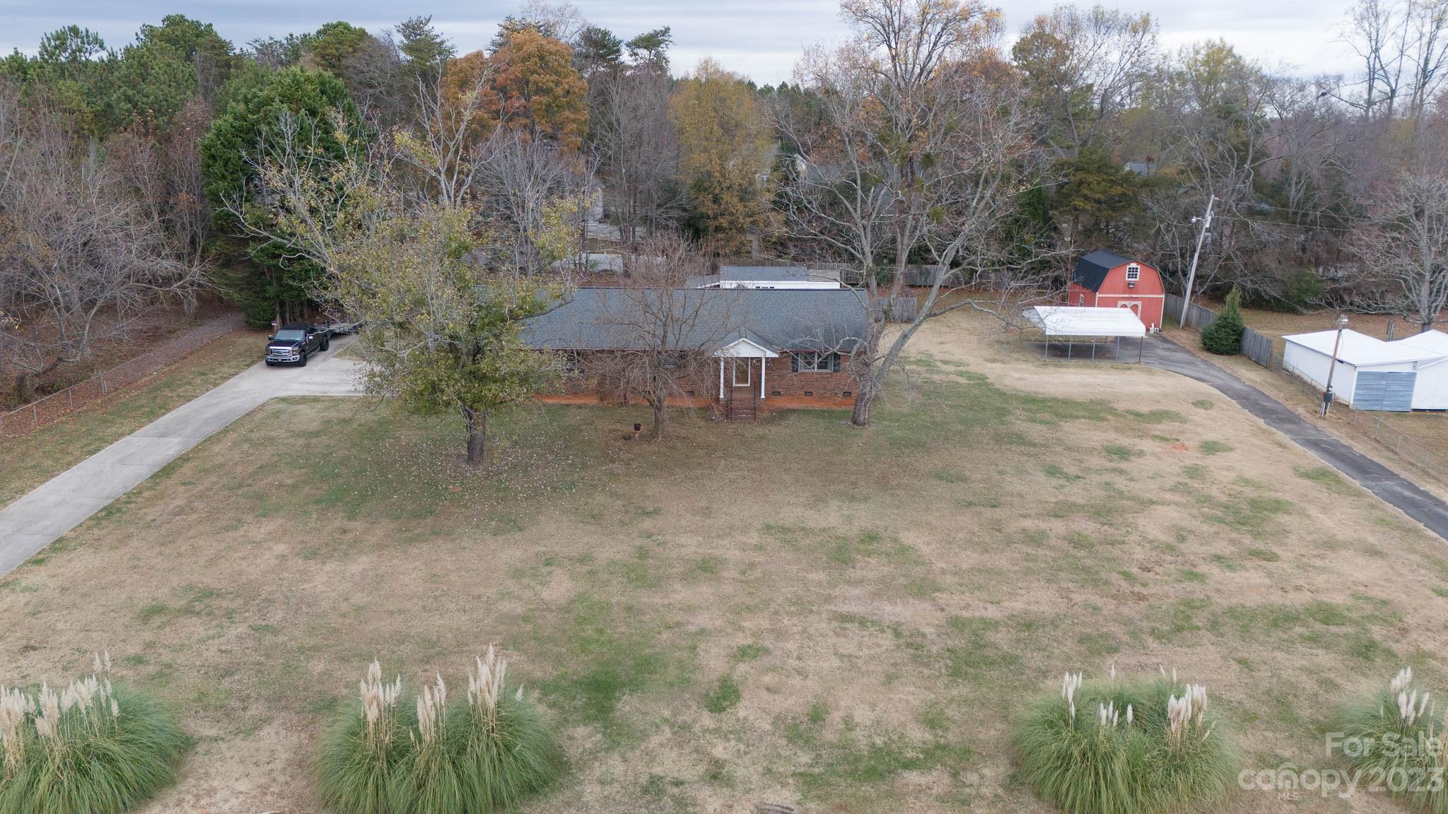 7869 Cherry Point Drive Denver, NC 28037 - Photo 38 of 38 a view of a chairs and table in the backyard