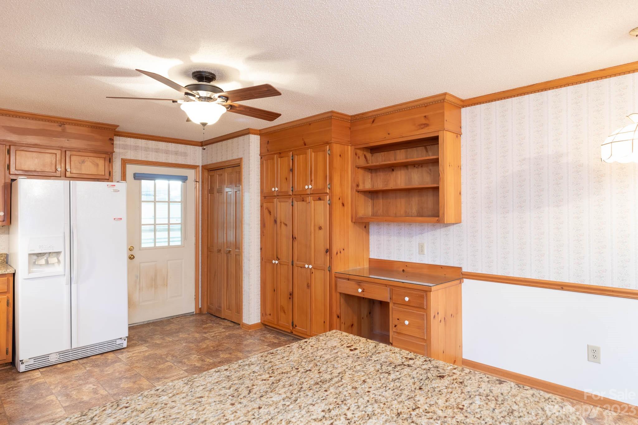 7869 Cherry Point Drive Denver, NC 28037 - Photo 5 of 38 a view of a livingroom with a kitchen and a window