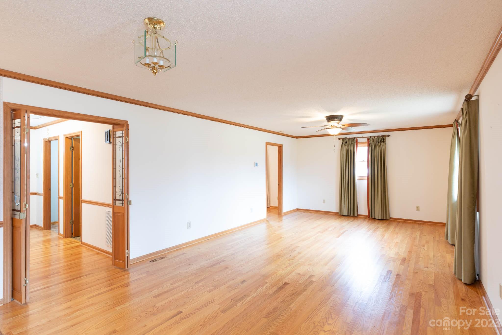 7869 Cherry Point Drive Denver, NC 28037 - Photo 6 of 38 a view of an empty room with wooden floor