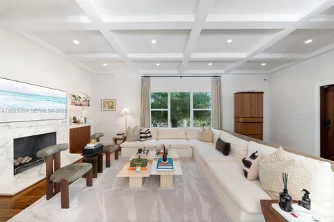 a living room with furniture and fireplace