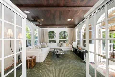 a view of a house with swimming pool and sitting area