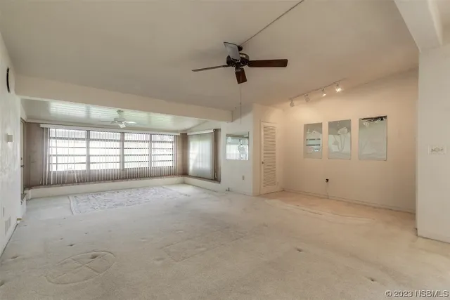 a view of an empty room with a window