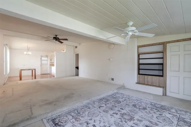 a view of empty room with a fireplace