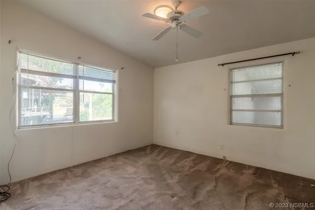 a view of an empty room with a window