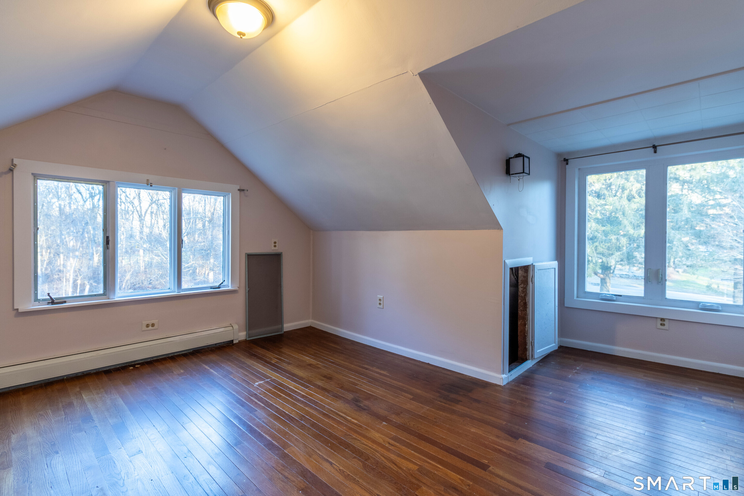 1661 Center Groton Road Ledyard, CT 06339 - Photo 32 of 39 an empty room with wooden floor and windows
